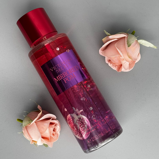 Victoria's Secret Mirror Pop perfume bottle with pink roses on a gray background